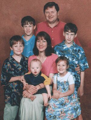 Jacob a child with Down Syndrome aged 1 year with his parents brothers and sister.